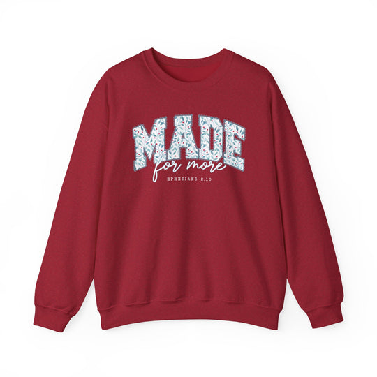 Deep red Made for More Crew sweatshirt with a leafy graphic design and biblical reference on chest, featuring a comfortable, loose fit ideal for casual wear.