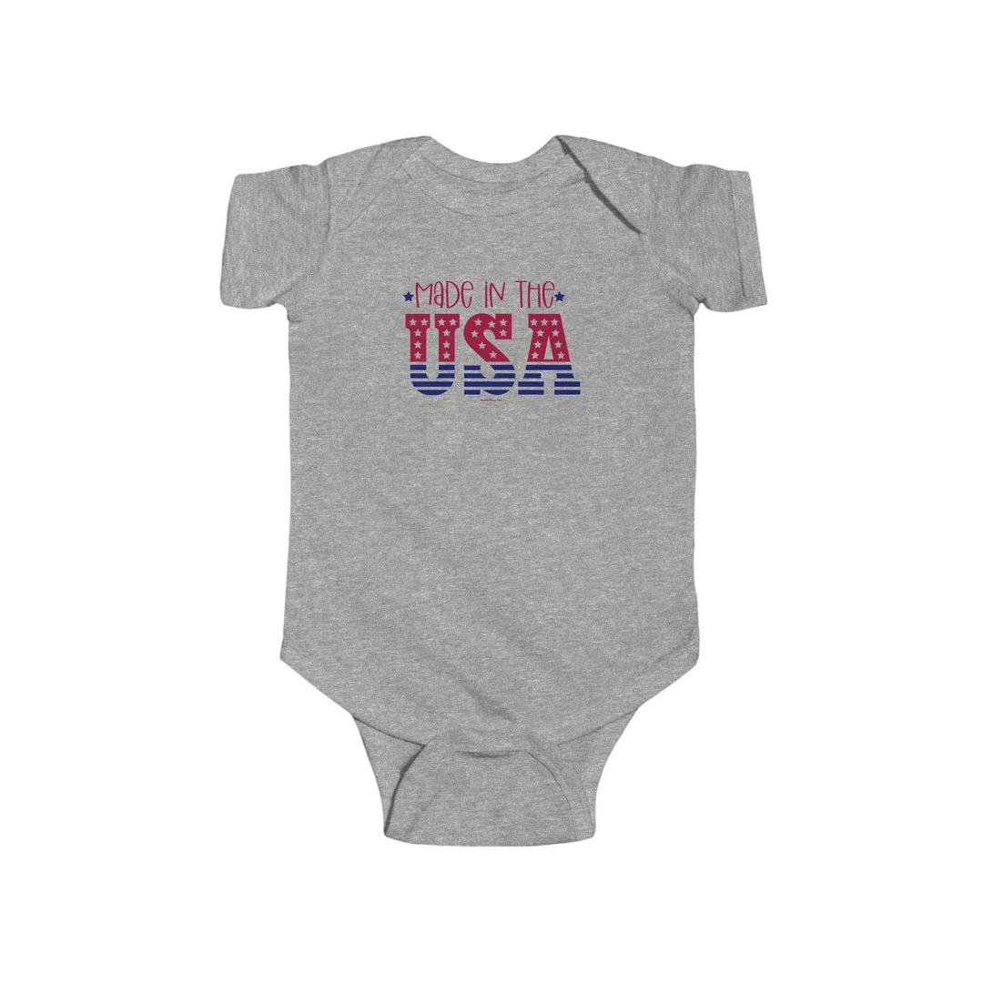 Made in the USA Onesie, grey bodysuit with red and blue text, 100% cotton, ribbed knit bindings, plastic snaps, infant fine jersey bodysuit, tear away label, light fabric, durable seams, sizes NB to 24M.