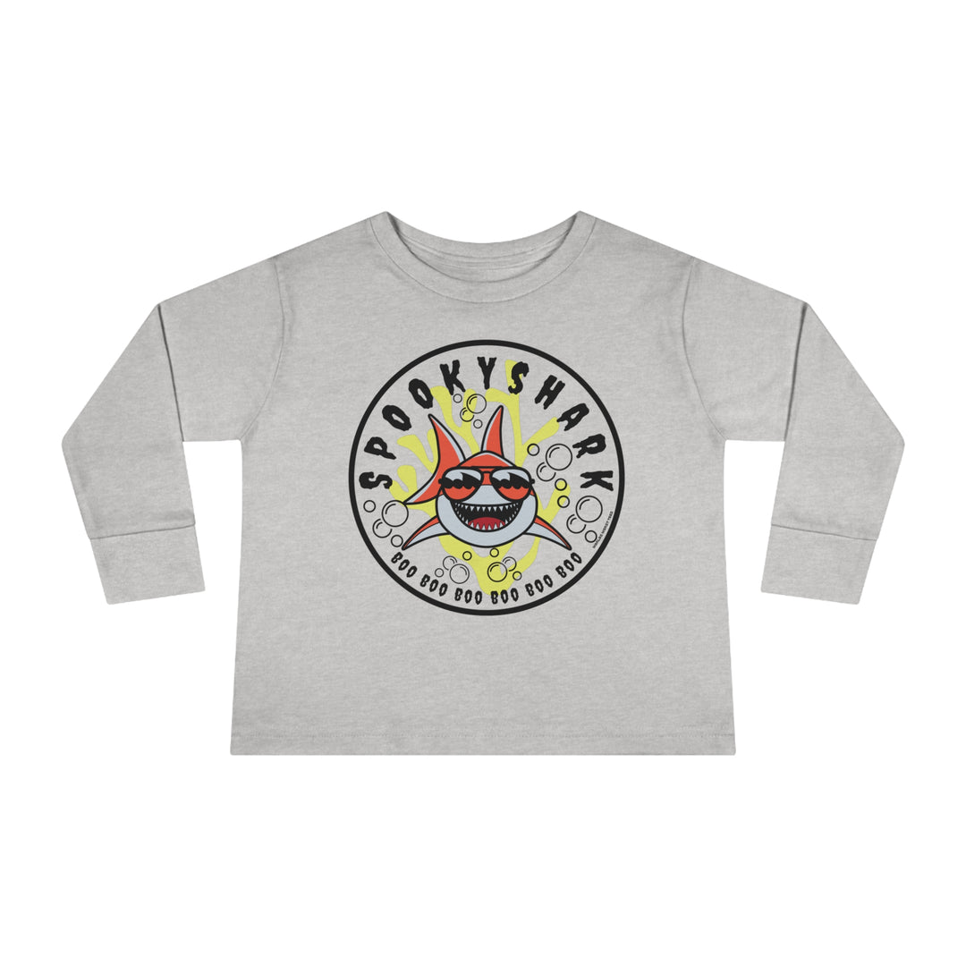 A toddler long-sleeve tee featuring a cartoon shark with sunglasses, designed for comfort and durability. Made from 100% combed ringspun cotton, with ribbed collar and EasyTear™ label. From 'Worlds Worst Tees'.