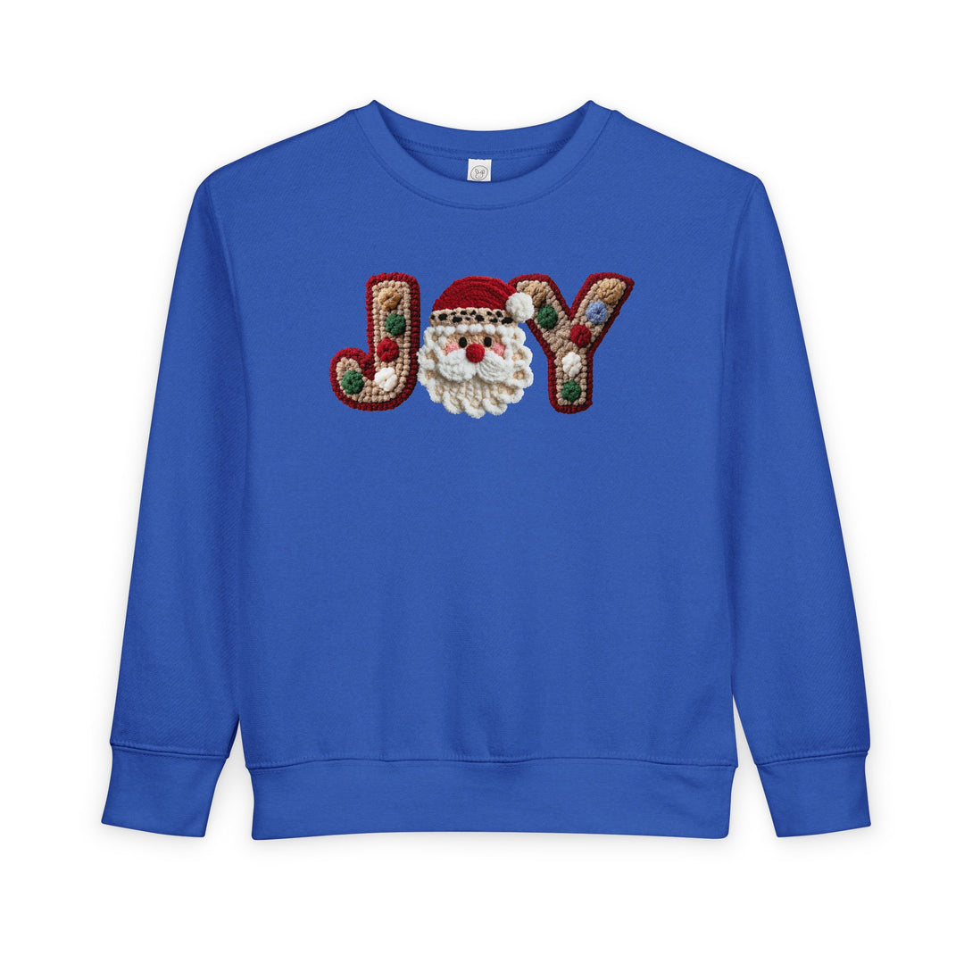 Joy Toddler Crew: Bright blue sweatshirt with JOY in multicolored embroidery, featuring a Santa face. Cozy, durable, ideal for toddlers.