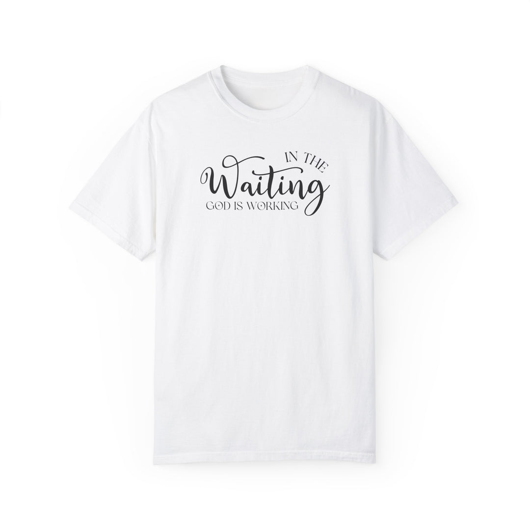 A relaxed fit God is Working Tee, crafted from 100% ring-spun cotton. Garment-dyed for extra coziness, featuring double-needle stitching for durability and a seamless design for a tubular shape.