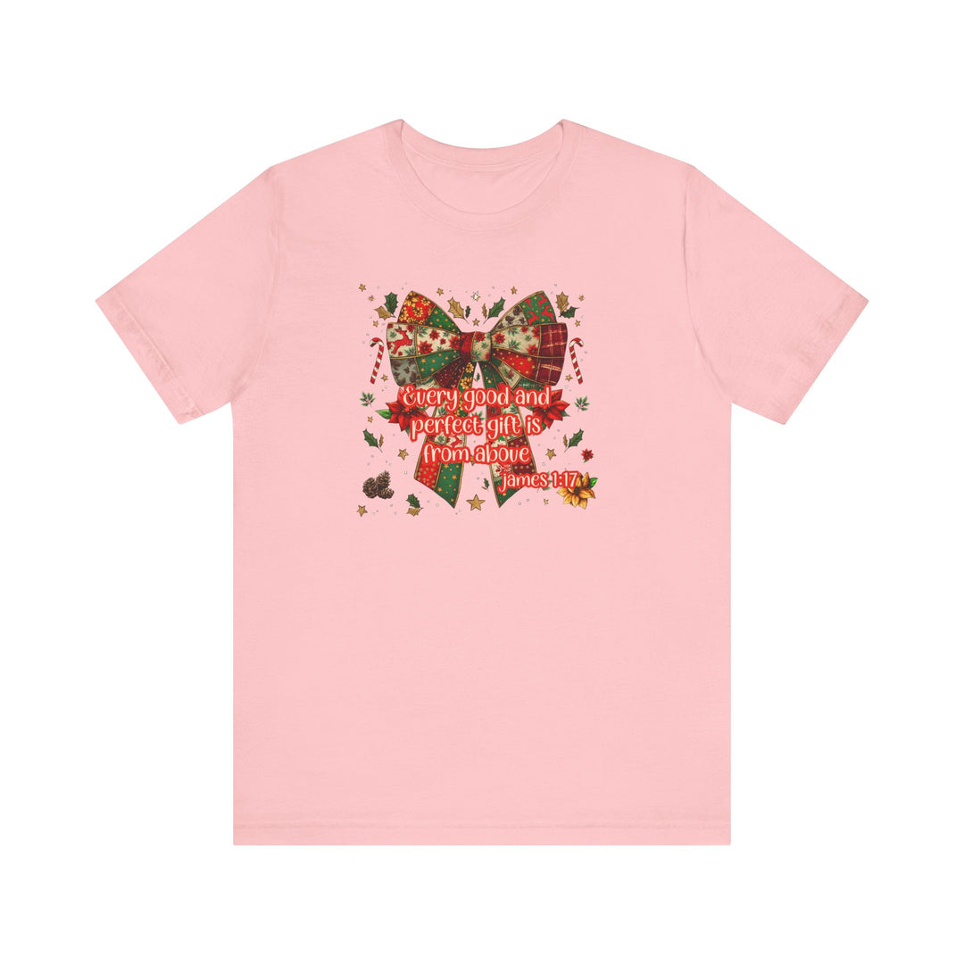 Light-pink Gift from Above Tee featuring a patchwork-style holiday bow with Bible verse James 1:17, surrounded by festive motifs.