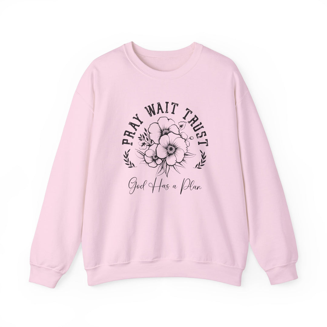 Pray Wait Trust Crew: Pink sweatshirt featuring a black and white flower design, long sleeves, ribbed knit collar, and a comfortable, loose fit.