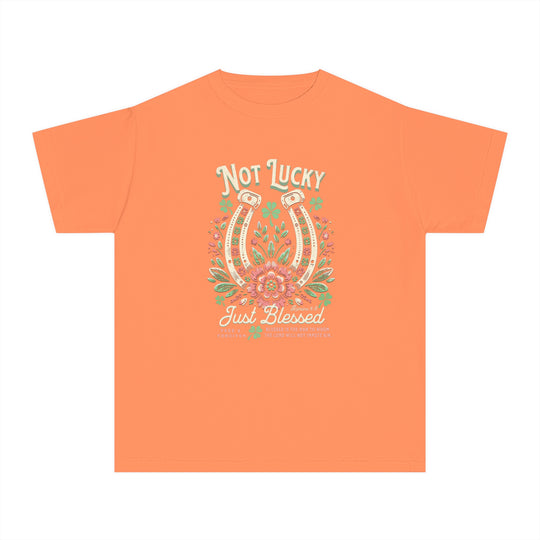 Blessed Tee: Orange t-shirt featuring a graphic horseshoe and flowers, designed for kids' active wear, crafted from soft, 100% combed ring-spun cotton for comfort.