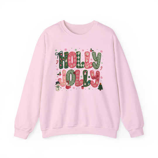 Light-pink crewneck sweatshirt with festive HOLLY JOLLY design, featuring holiday-themed letters and illustrations, ideal for cozy seasonal wear.