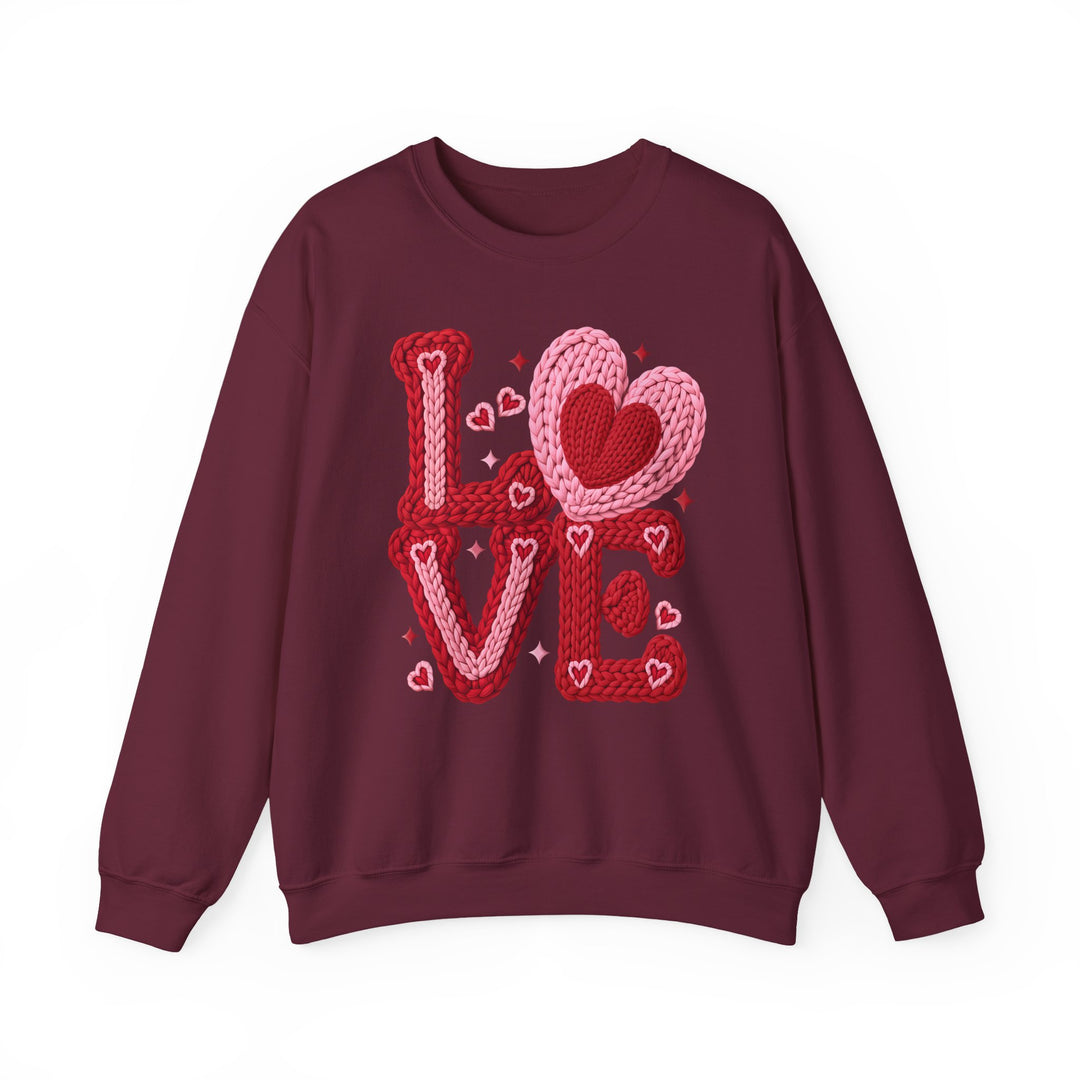 Love Heart Crew: Burgundy crewneck sweatshirt featuring “LOVE” in chunky yarn letters with heart motifs, offering a comfortable fit with a ribbed collar.