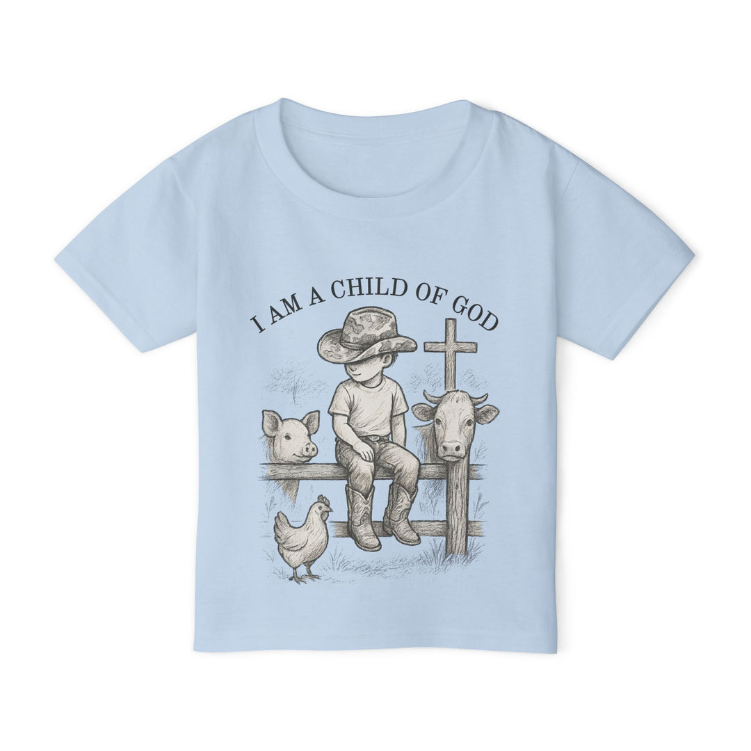 Toddler tee displaying I AM A CHILD OF GOD with a vintage-style sketch of a boy, cowboy hat, animals, and cross, epitomizing Faith Family Designs' charming graphic apparel.