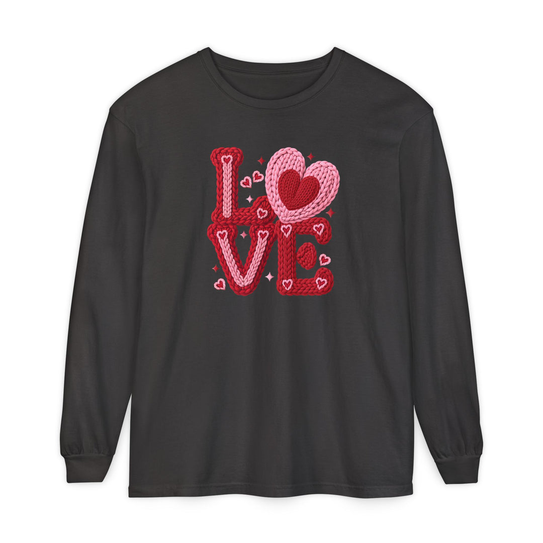 Black long-sleeve Love Heart tee with red and pink yarn-textured LOVE graphic, featuring a heart-shaped O, ideal for casual comfort.