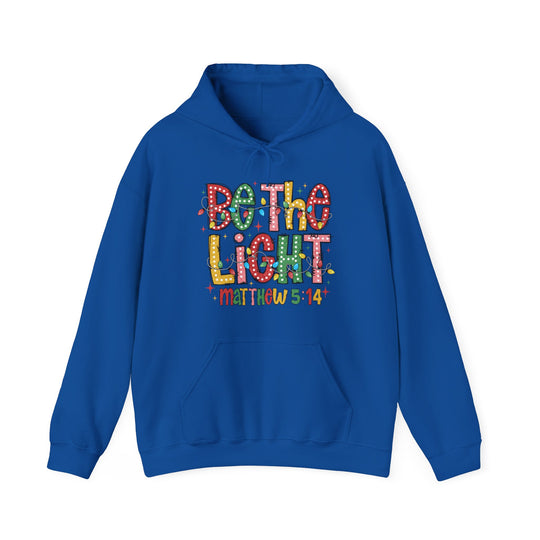 Royal-blue hoodie with Be The Light graphic and Matthew 5:14 text, featuring a cozy fit and kangaroo pocket. Ideal for cold days.