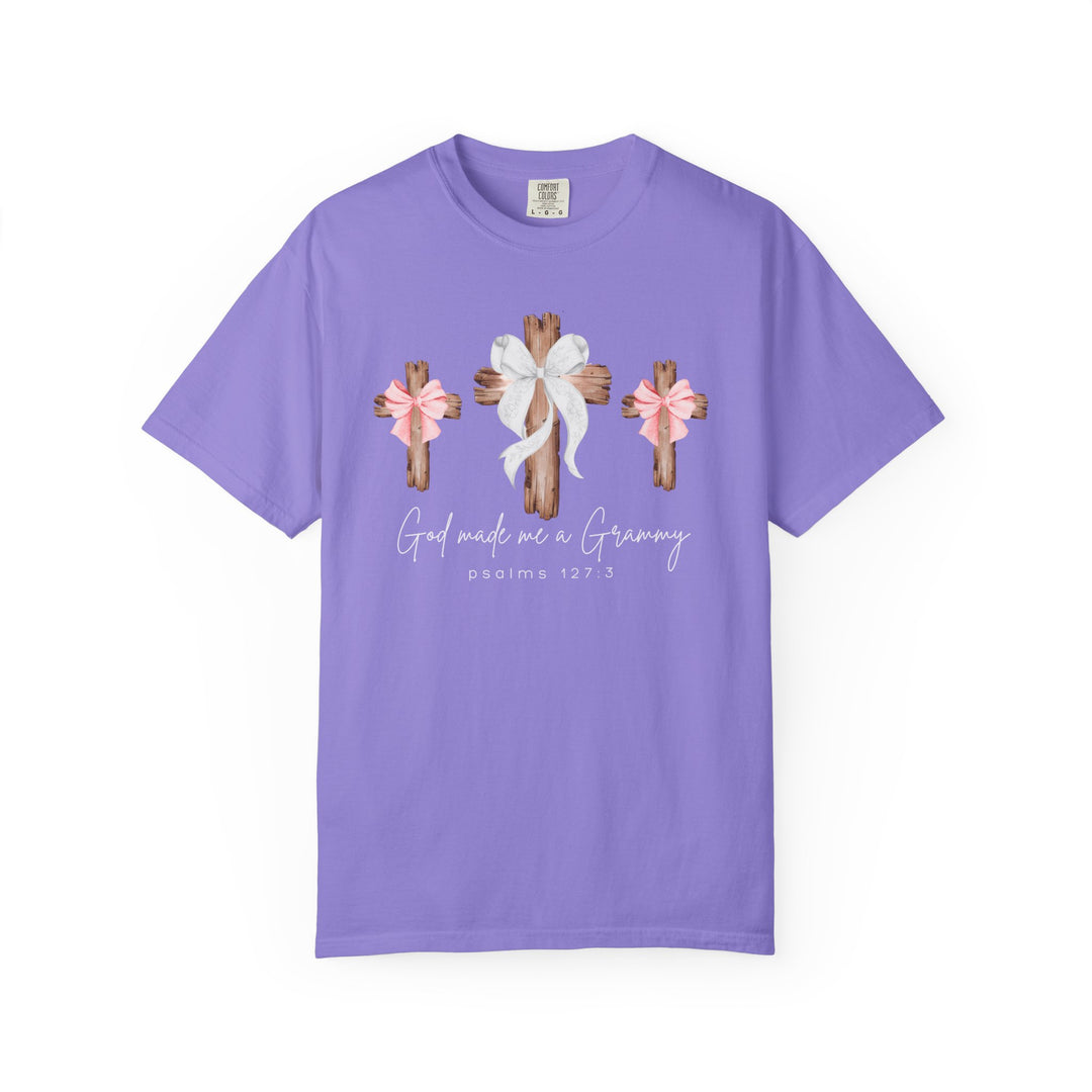Lilac God Made Me a Grammy T-shirt featuring wooden crosses with bows, emphasizing faith and family, made from soft, durable, 100% ring-spun cotton. 