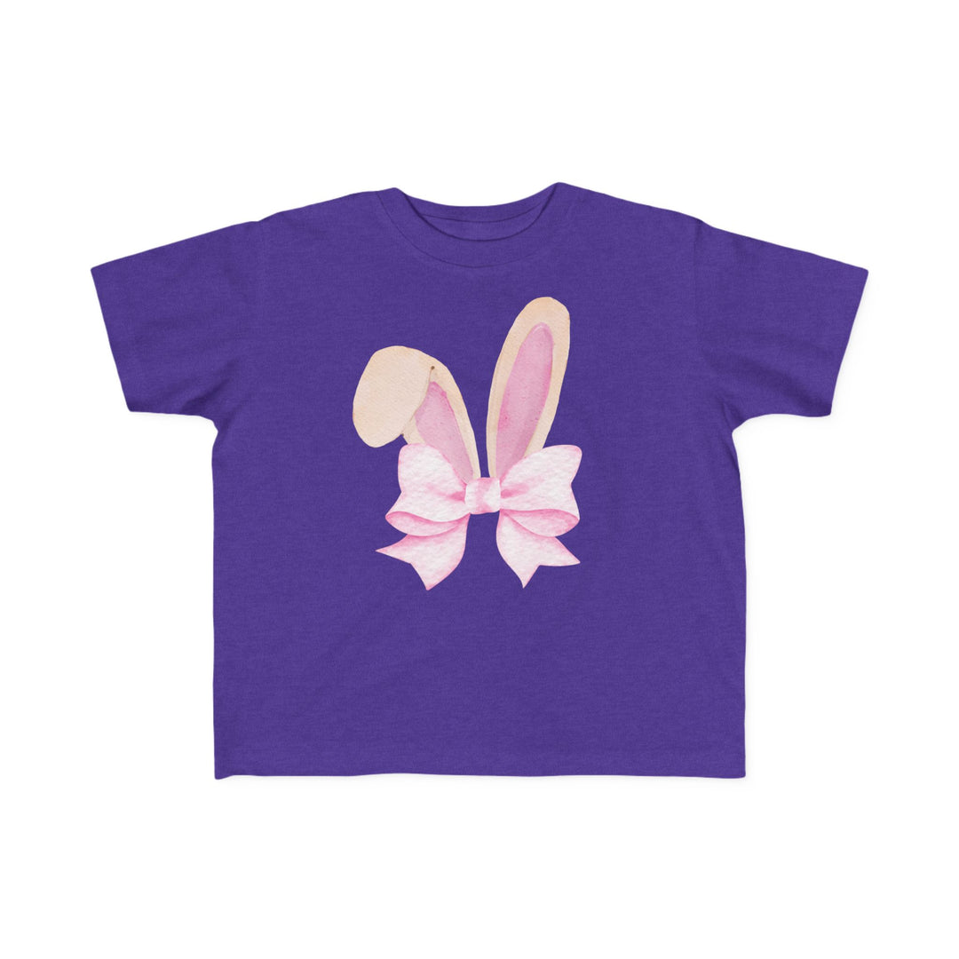 Bunny Bow Toddler Tee featuring stylized bunny ears with a pink ribbon bow, designed for comfort with soft, durable fabric ideal for toddlers.