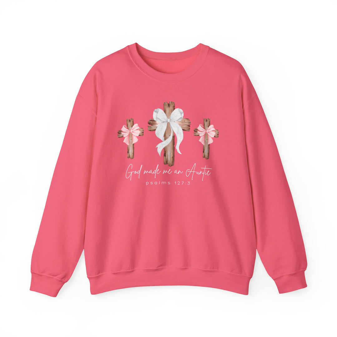 Pink crew-neck sweatshirt featuring three rustic crosses with bows and the phrase “God made me an Auntie” above “Psalms 127:3” in cursive style.