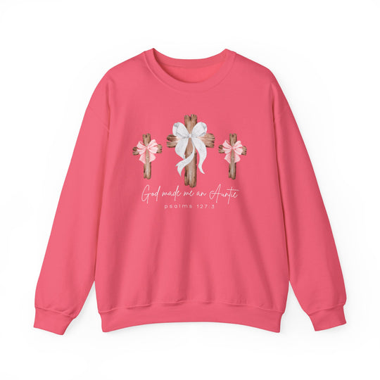 Pink crew-neck sweatshirt featuring three rustic crosses with bows and the phrase “God made me an Auntie” above “Psalms 127:3” in cursive style.