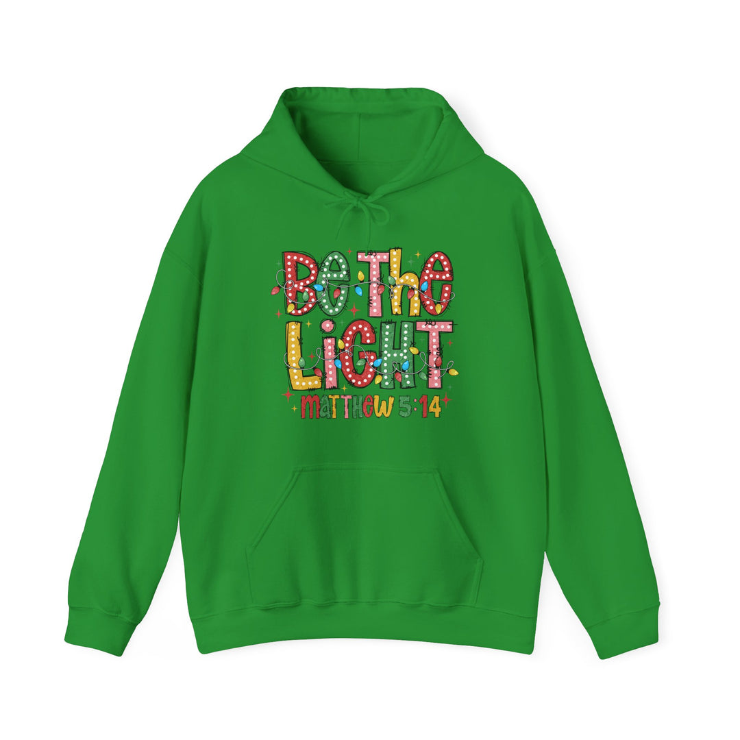 Bright green Be the Light hoodie with holiday string lights graphic, kangaroo pocket, and Matthew 5:14 reference. Cozy blend, unisex fit, designed by Faith Family Designs.