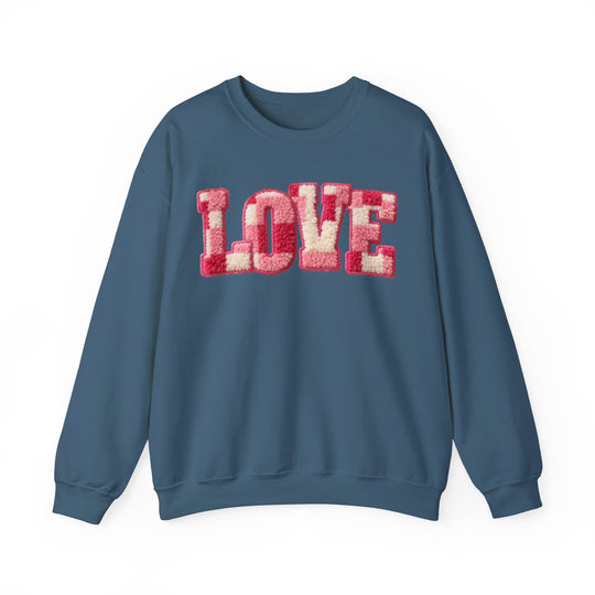 Muted blue Love Crew sweatshirt with tufted-chenille LOVE appliqué in pink and off-white on chest, flat display.