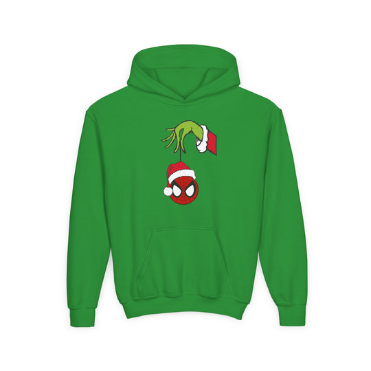 Spider Ball Christmas Youth Hoodie features a playful Grinch hand holding a Spider-Man ornament, perfect for holiday fun. Ultra-soft fleece with kangaroo pocket.