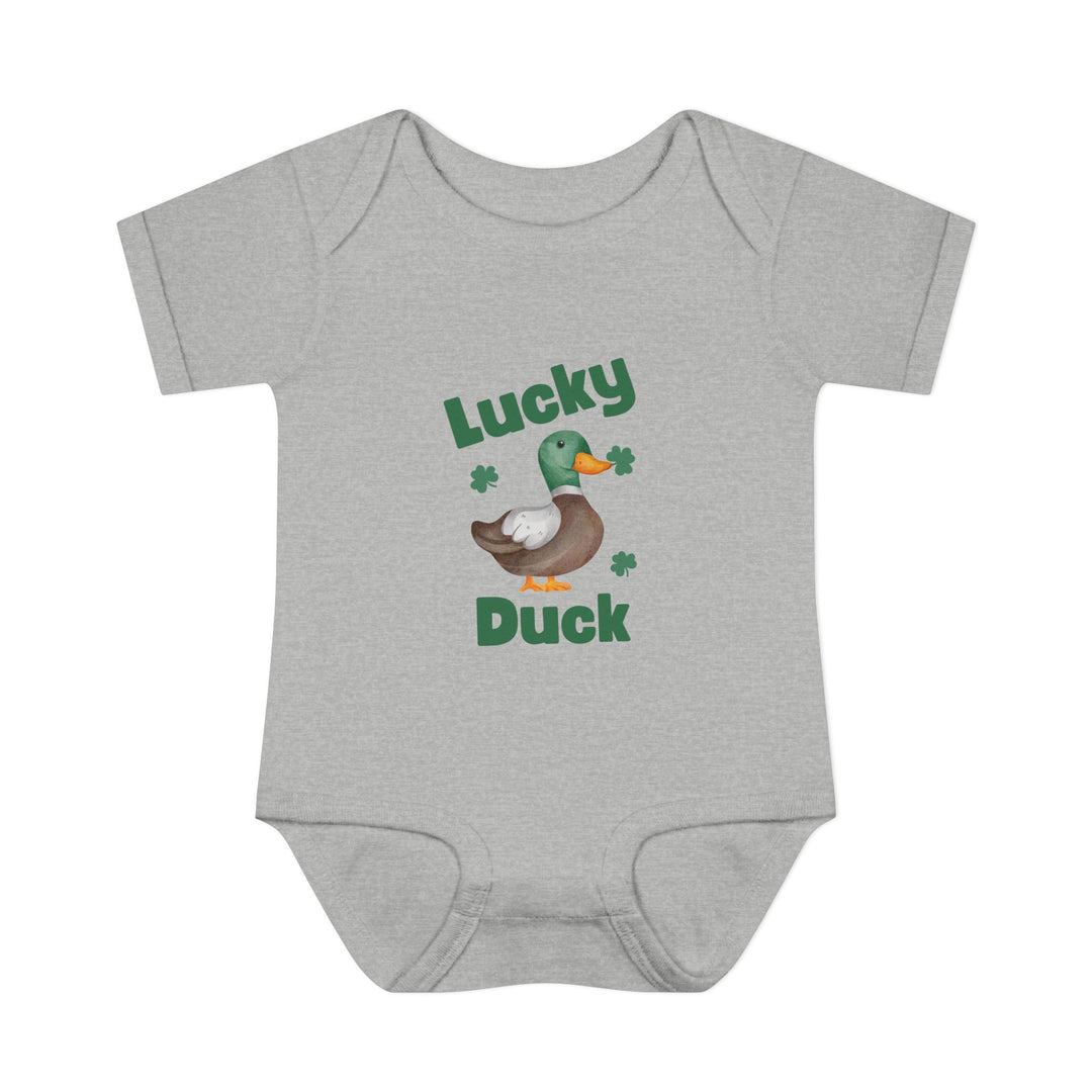 Lucky Duck Onesie: Grey baby bodysuit featuring a cartoon duck with clovers, designed for comfort with lap shoulders and soft ring-spun cotton.