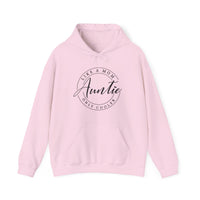 Auntie Hoodie: Pink sweatshirt featuring black text, unisex design with a kangaroo pocket and matching drawstring. Made from a cotton-polyester blend for comfort and warmth.