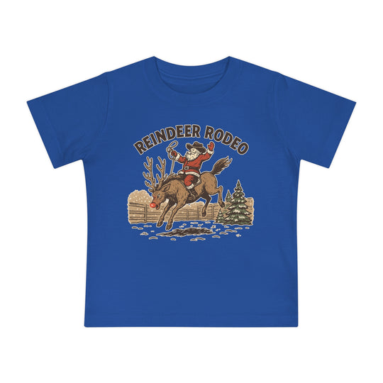 Reindeer Rodeo Baby Tee featuring Santa as a cowboy riding a reindeer, perfect for babies. Soft and durable, ideal for festive, playful style.