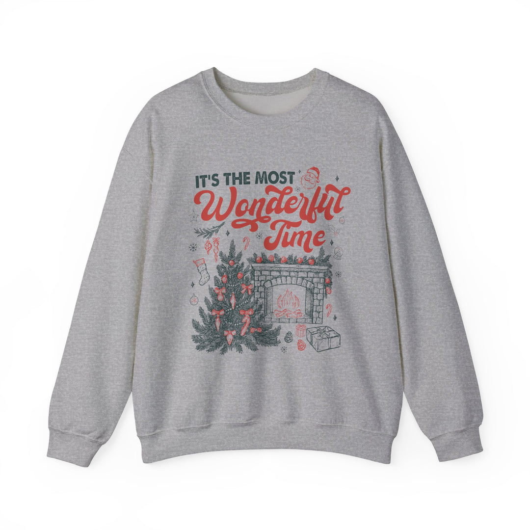 Light-heather-gray crewneck sweatshirt featuring Most Wonderful Time with festive Christmas graphics, including a tree, fireplace, and Santa, designed for cozy holiday comfort.