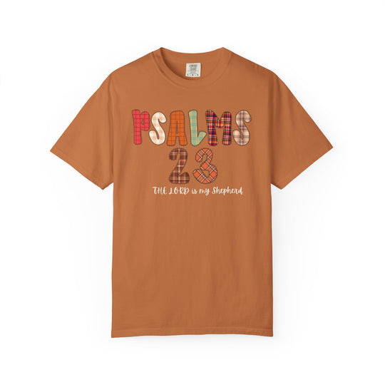 Psalms 23 Tee features a rust-orange cotton T-shirt with fall-inspired patchwork text PSALMS 23 and script The LORD is my Shepherd across the chest.