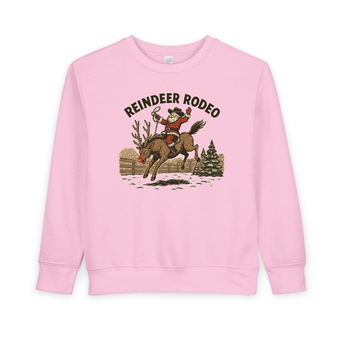 Reindeer Toddler Crew sweatshirt featuring Santa as a cowboy on a bucking reindeer with REINDEER RODEO text, perfect for cozy, festive toddler wear.
