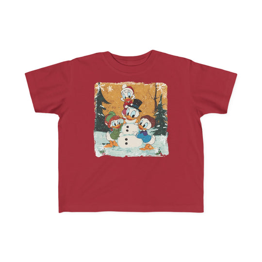 Duck Snowmen Toddler Tee: Red T-shirt featuring Disney’s Scrooge McDuck and nephews building a snow-duck in a snowy forest, ideal for toddlers' sensitive skin.