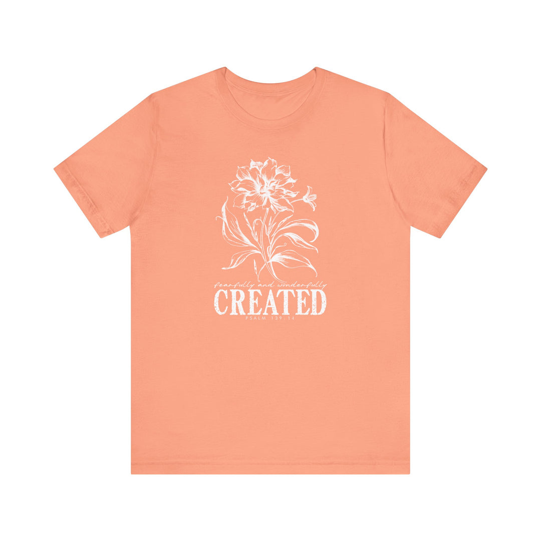 The Created Tee is a unisex jersey short sleeve shirt featuring a classic crew neckline, soft cotton fabric, and ribbed knit collars for lasting comfort and style.