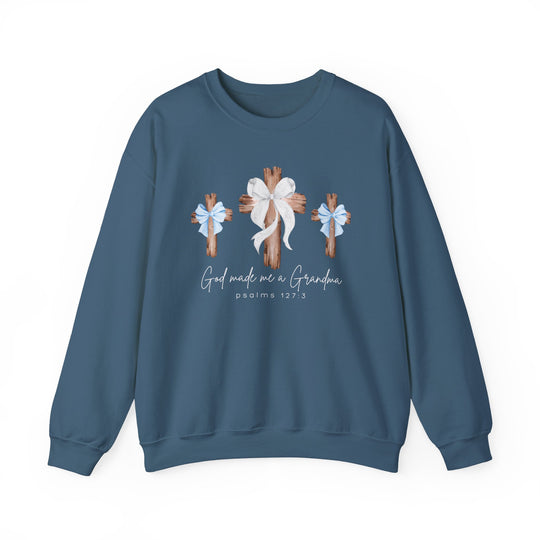 Blue crew-neck sweatshirt featuring three wooden crosses with bows and the phrase “God Made Me a Grandma” in a cozy, unisex heavy blend fabric.