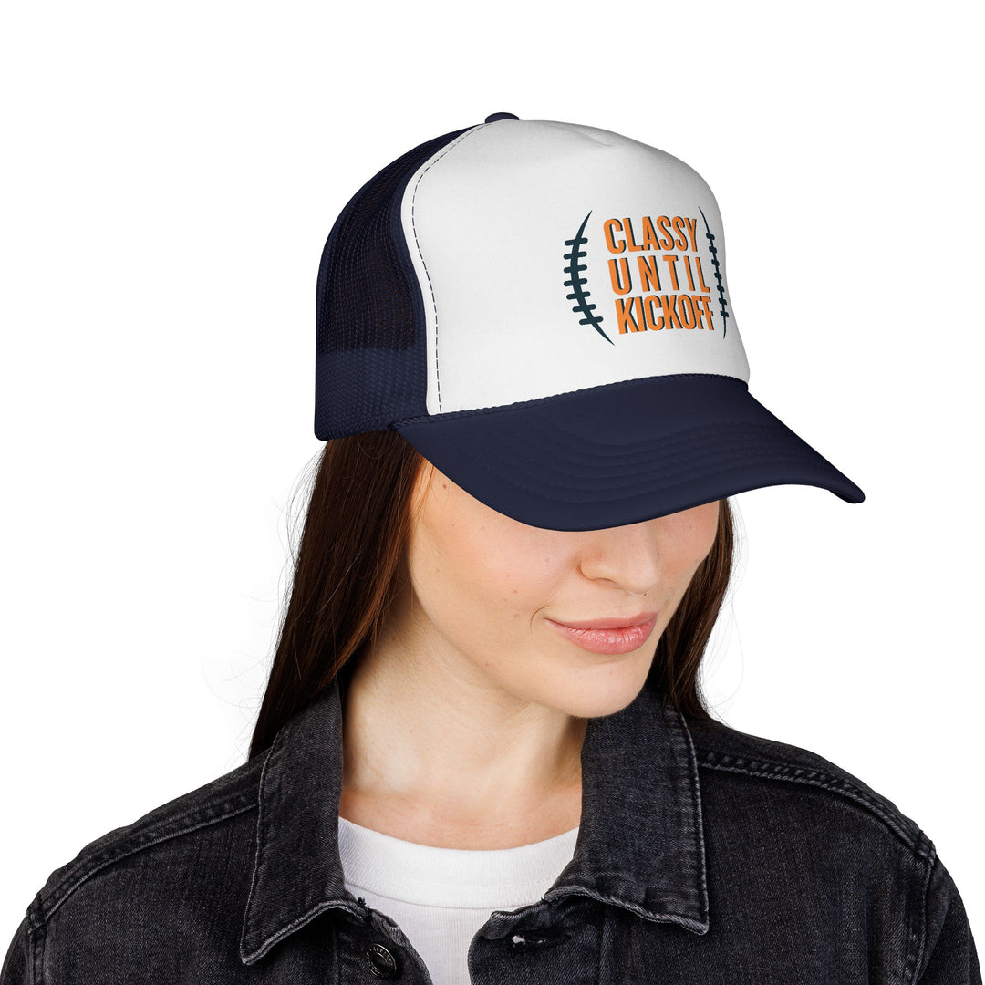 Model wearing Bronco Trucker Cap with CLASSY UNTIL KICKOFF slogan, paired with a dark denim jacket and white T-shirt, representing versatile, durable headwear.