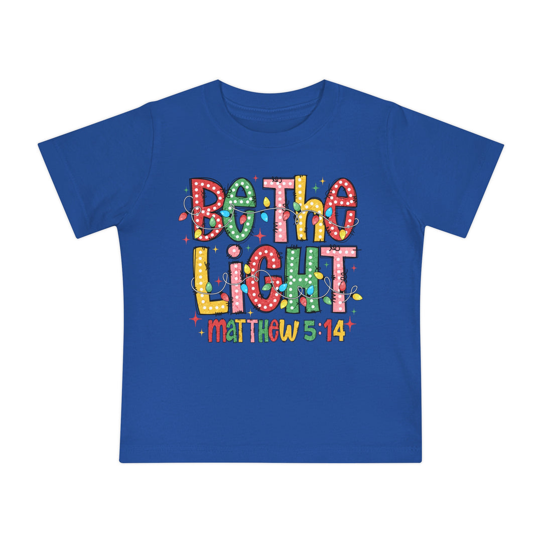 Be the Light Baby Tee: Royal-blue kids' T-shirt featuring Be the Light in colorful, marquee-style letters with string lights, referencing Matthew 5:14.