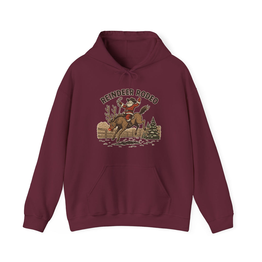 Reindeer Rodeo Hoodie featuring Santa on a reindeer with a cowboy twist, ideal for cozy warmth and festive flair.