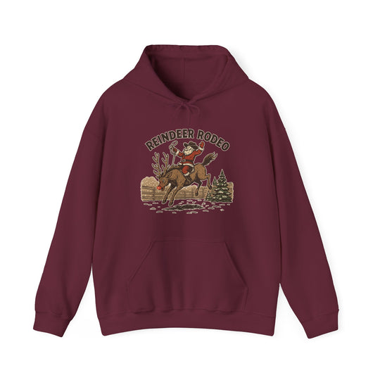 Reindeer Rodeo Hoodie featuring Santa on a reindeer with a cowboy twist, ideal for cozy warmth and festive flair.