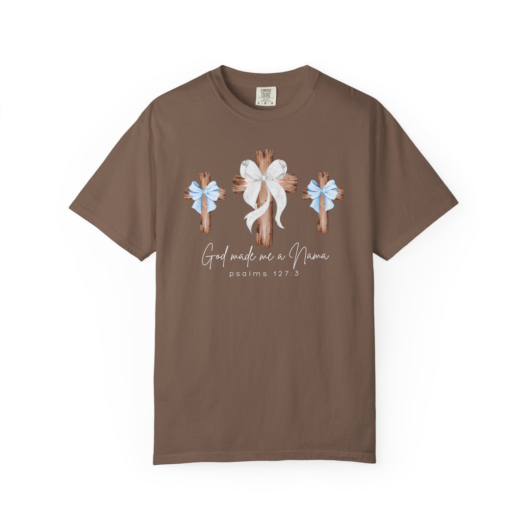 God Made Me a Mama Tee with three wooden crosses, blue and white bows, and scripture text on a chocolate Comfort Colors-style t-shirt.