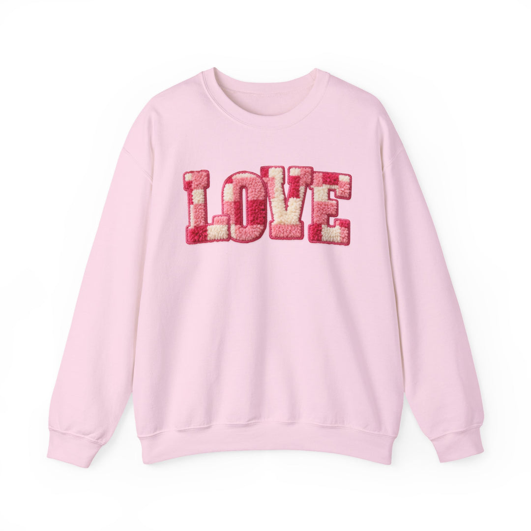 Light-pink Love Crew sweatshirt with chenille-style letters, showcasing a comfortable, unisex fit and ribbed knit collar for durability.