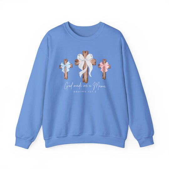 God Made Me a Girl - Boy Mama Crew: Light-blue sweatshirt with three rustic crosses and God made me a Mama text, emphasizing faith and family design.