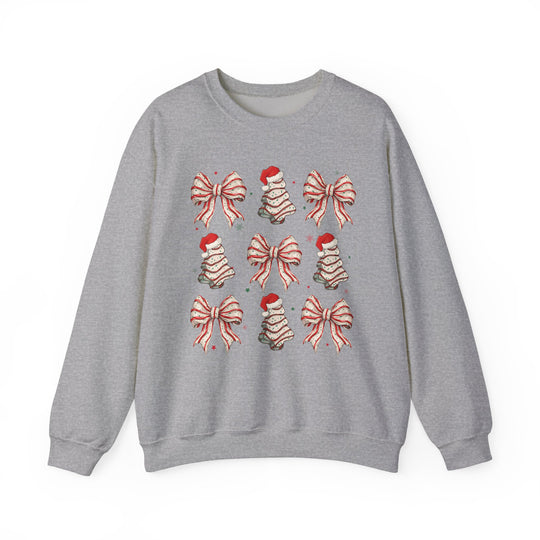 Cookies and Bows Crew: Light heather-gray sweatshirt featuring a grid of red-and-white striped bows and Christmas trees with Santa hats, accented with red and green stars.