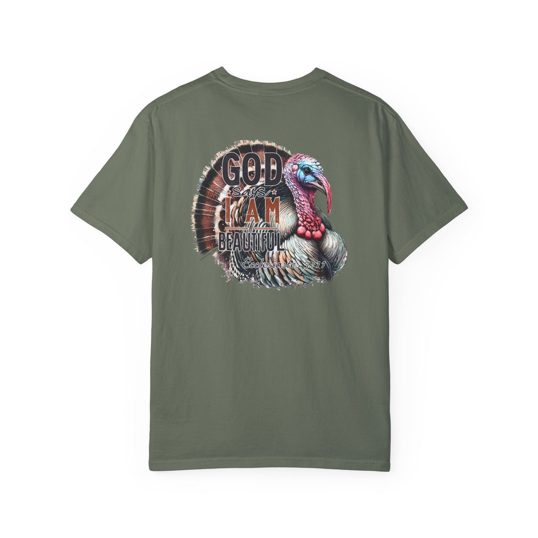 A green tee with a turkey design, the I am Beautiful Tee from Worlds Worst Tees. 100% ring-spun cotton, garment-dyed for coziness, with double-needle stitching for durability and a relaxed fit.