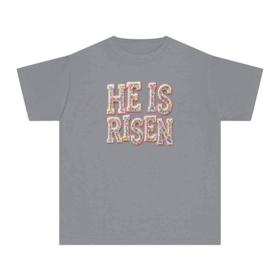 He is Risen Kids Tee with pastel floral text on gray, made from soft-washed combed cotton, perfect for active kids' comfort and style.