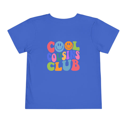Cool Cousins Club Toddler Tee, a soft, 100% cotton shirt with a comfortable tear-away label, perfect for everyday wear by toddlers.