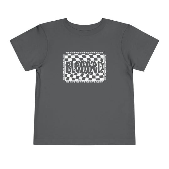 Blessed Toddler Tee: Grey t-shirt with a black and white checkered design, crafted from 100% Airlume cotton for comfort. Ideal for everyday wear.