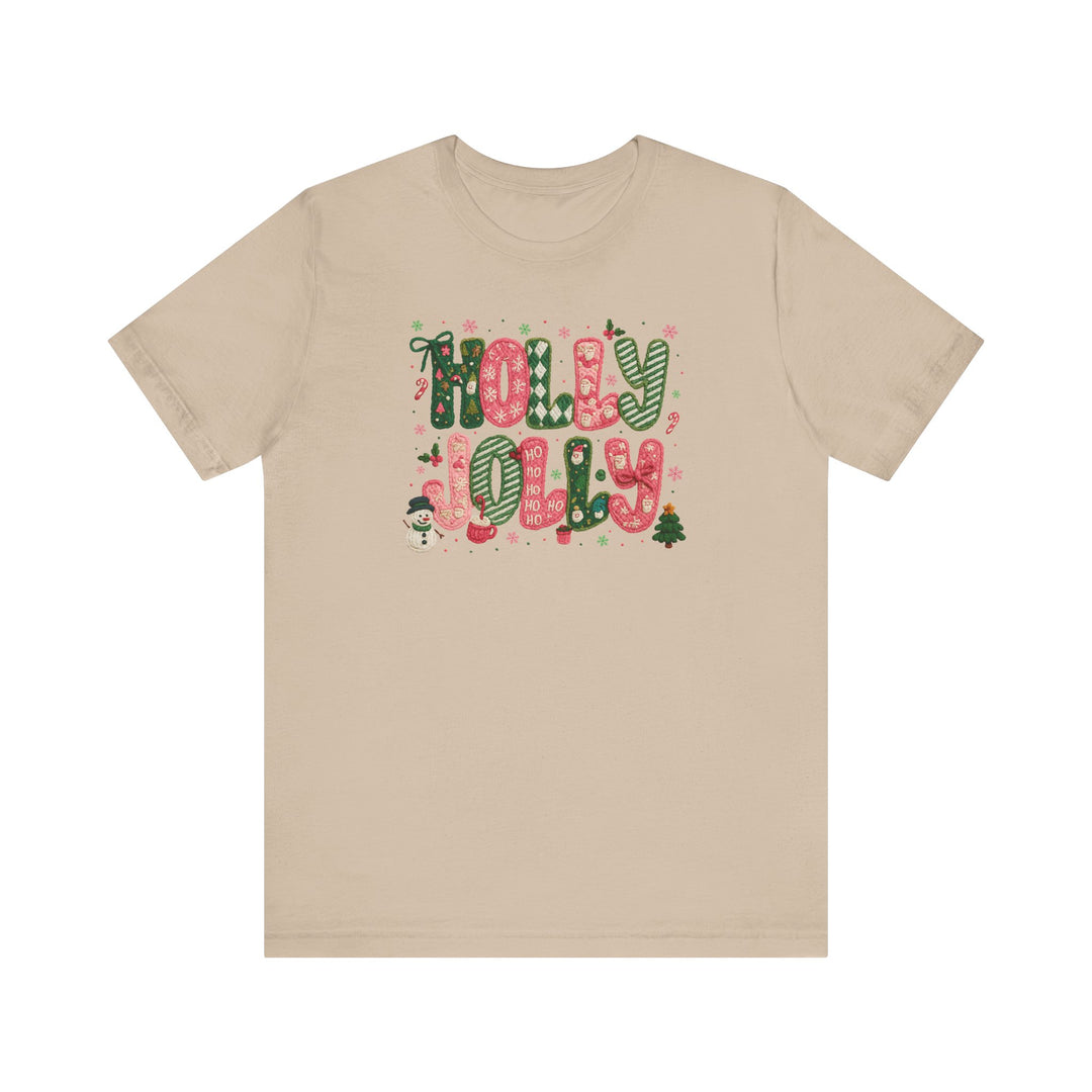 Holly Jolly Tee featuring festive red-and-green holiday graphics with HOLLY JOLLY text and seasonal illustrations, offering a soft, classic fit ideal for holiday wear.