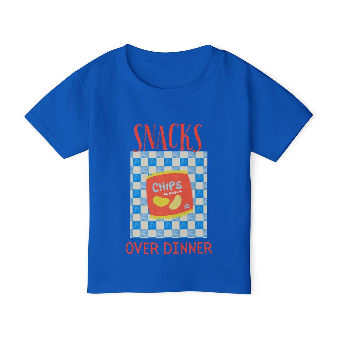 Heavy Cotton™ Toddler T-shirt featuring a graphic of a potato chip bag on a checkerboard, emblazoned with SNACKS OVER DINNER. Crafted from eco-friendly, 100% cotton.