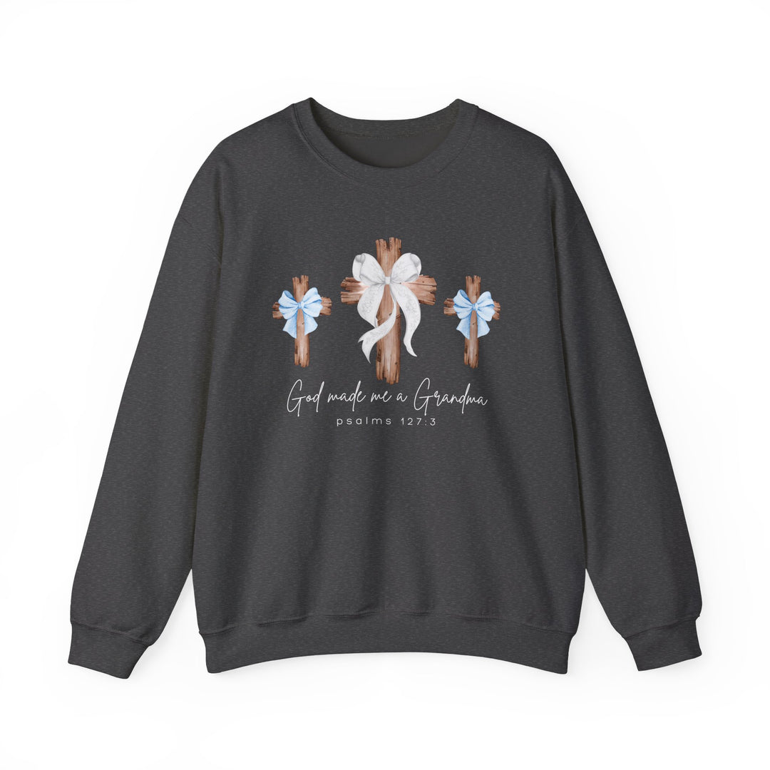 God Made Me a Grandma Crew sweatshirt featuring three wooden crosses with bows and script text, designed for comfort with a polyester-cotton blend.
