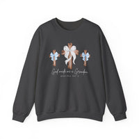 God Made Me a Grandma Crew sweatshirt featuring three wooden crosses with bows and script text, designed for comfort with a polyester-cotton blend.
