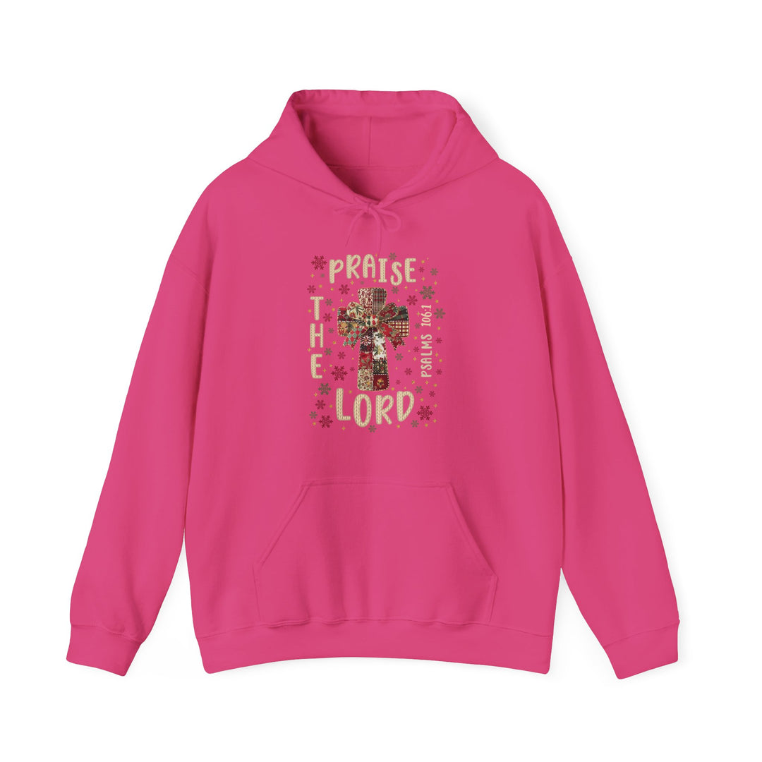 Bright pink Praise the Lord hoodie featuring a patchwork cross graphic with bow and snowflakes, kangaroo pocket, and drawstring hood for cozy comfort.