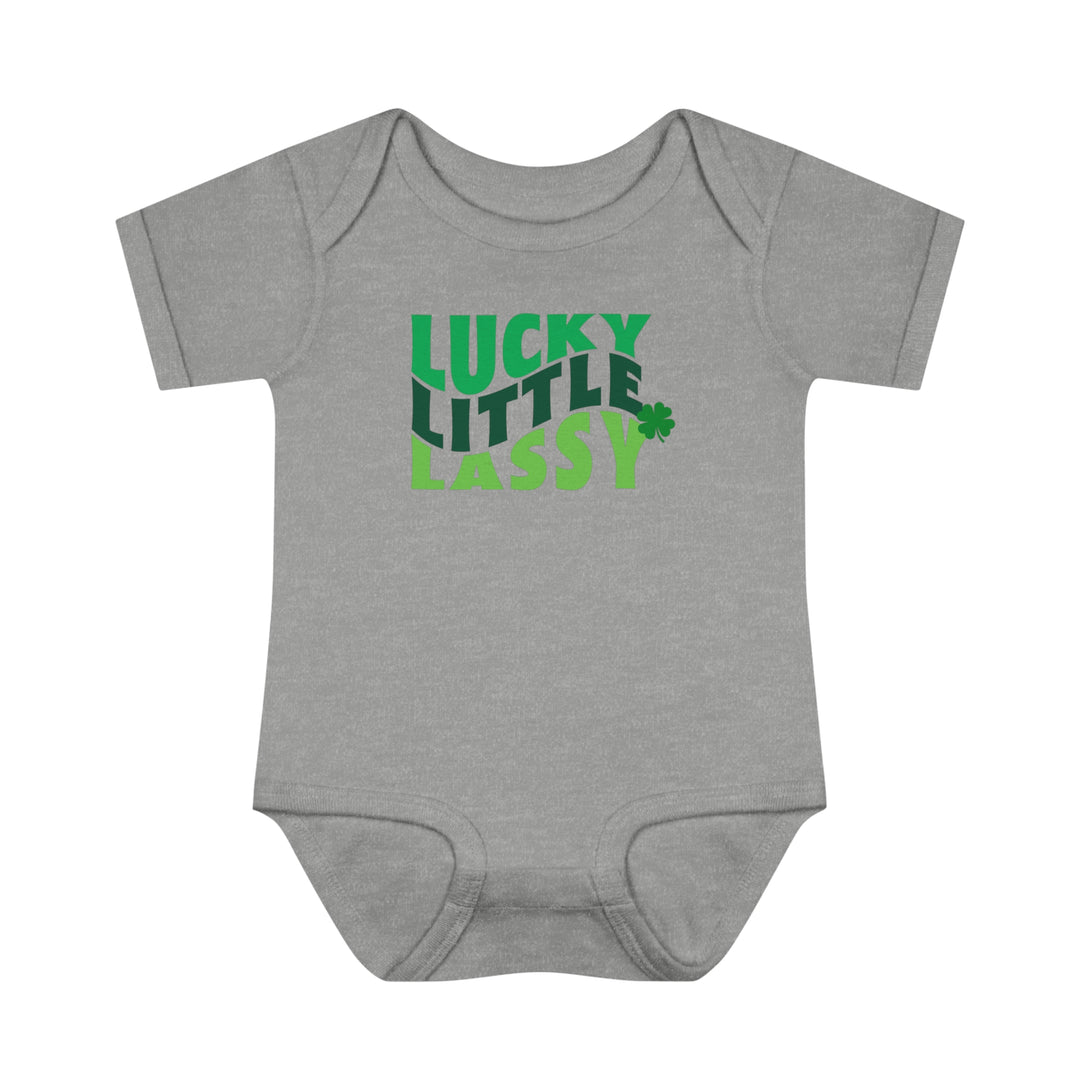 A Lucky Little Lassy Onesie for infants, featuring soft ring-spun cotton, lap shoulders, and a tear-away label. Unisex fit, light fabric, perfect for younglings. From Worlds Worst Tees.
