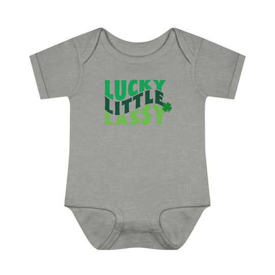 A Lucky Little Lassy Onesie for infants, featuring soft ring-spun cotton, lap shoulders, and a tear-away label. Unisex fit, light fabric, perfect for younglings. From Worlds Worst Tees.