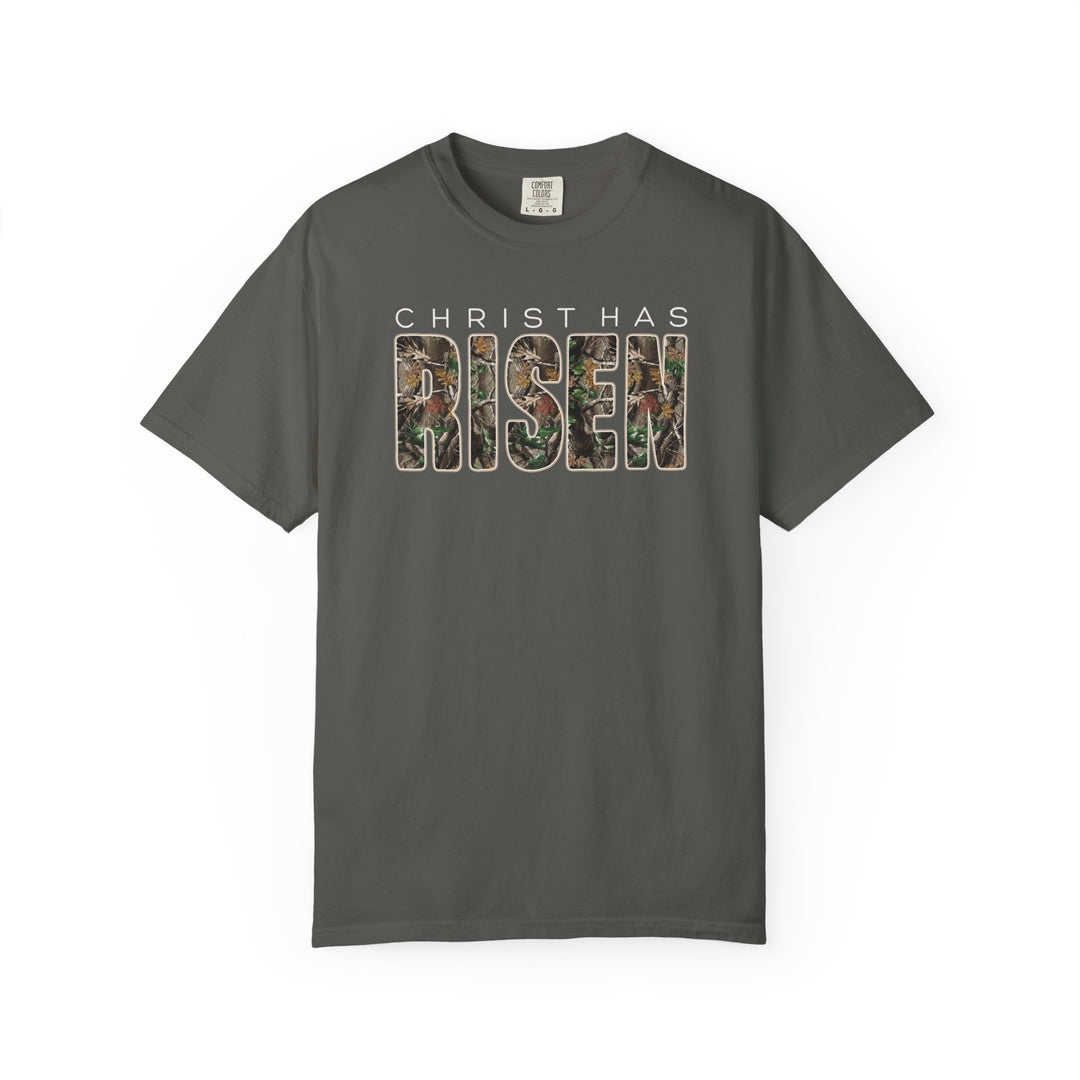 Christ Has Risen Tee with woodland camouflage design, unisex Comfort Colors style, featuring relaxed fit and garment-dyed fabric for ultimate comfort.