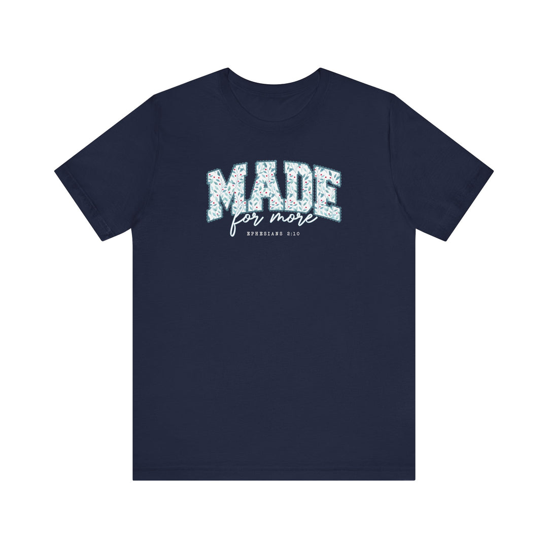 Navy-blue Made For More Tee with floral-patterned MADE slogan and EPHESIANS 2:10 reference, showcasing Faith Family Designs' unique graphic style.